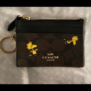 Coach X Peanuts Mini Skinny ID case with Woodstock dark canvas print